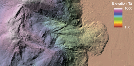 LiDAR bare-earth hillshade colored by elevation of the same area on Sumas Mountain, revealing a large landslide with a curved head scarp, a hummocky body, and a rounded toe spreading onto the valley floor